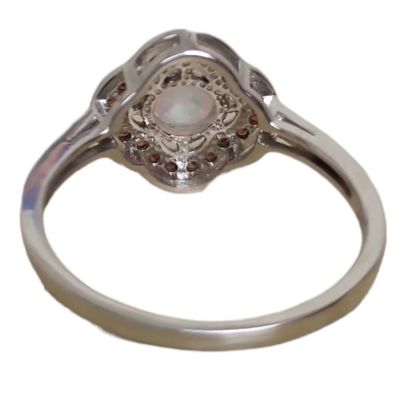 Sterling Silver Garnet Created White Opal Flower Ring - Picture 13 of 16